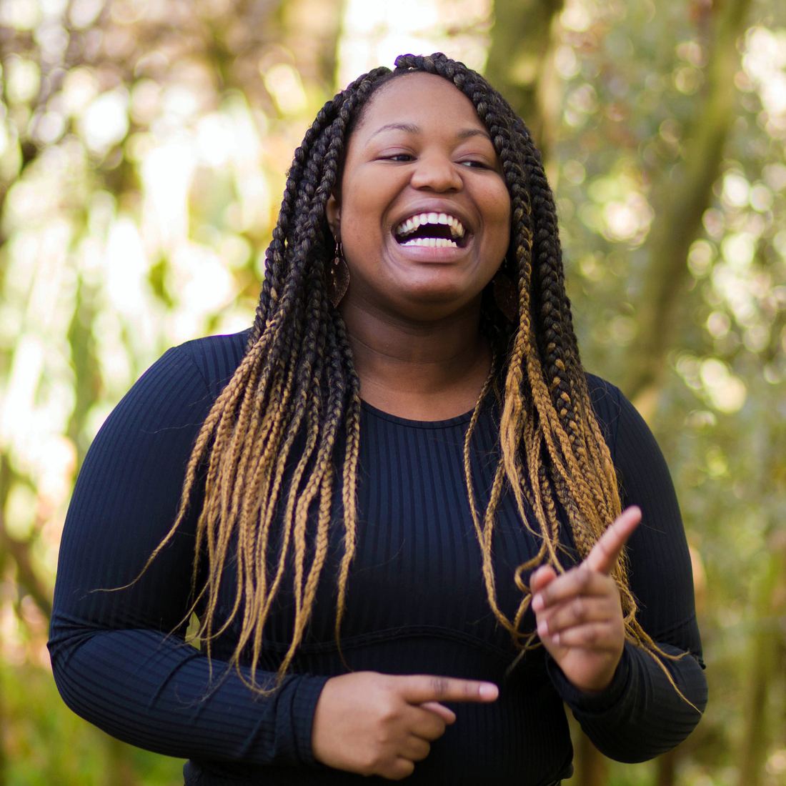 A young creative laughing at a You Press session